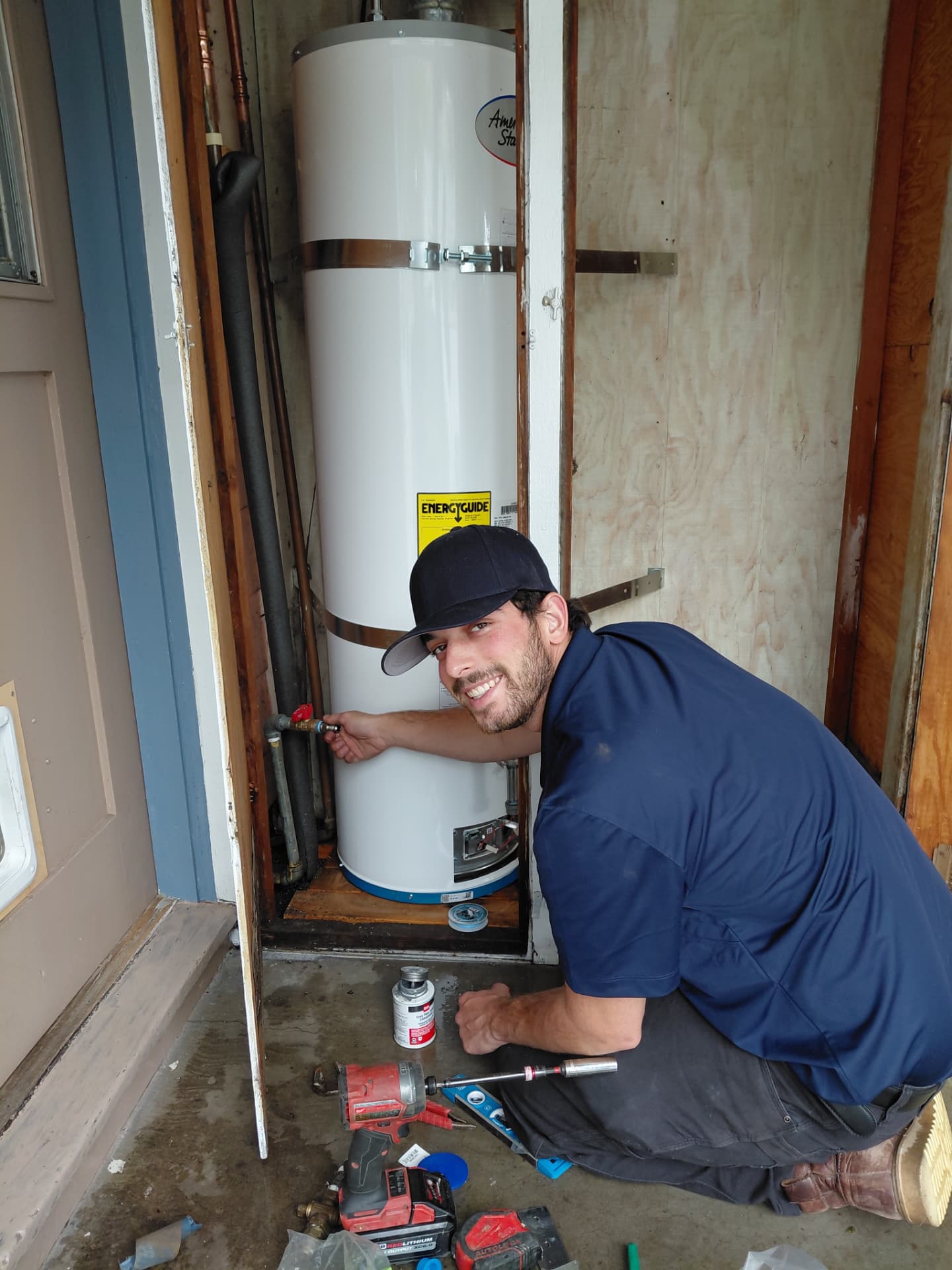 Yorkshire Plumbing technician installing a new water heater